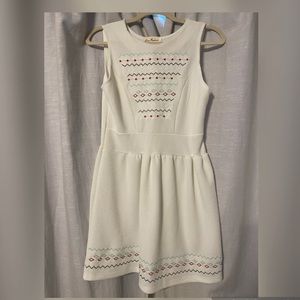 White knee length dress with embroidered design. Never worn.